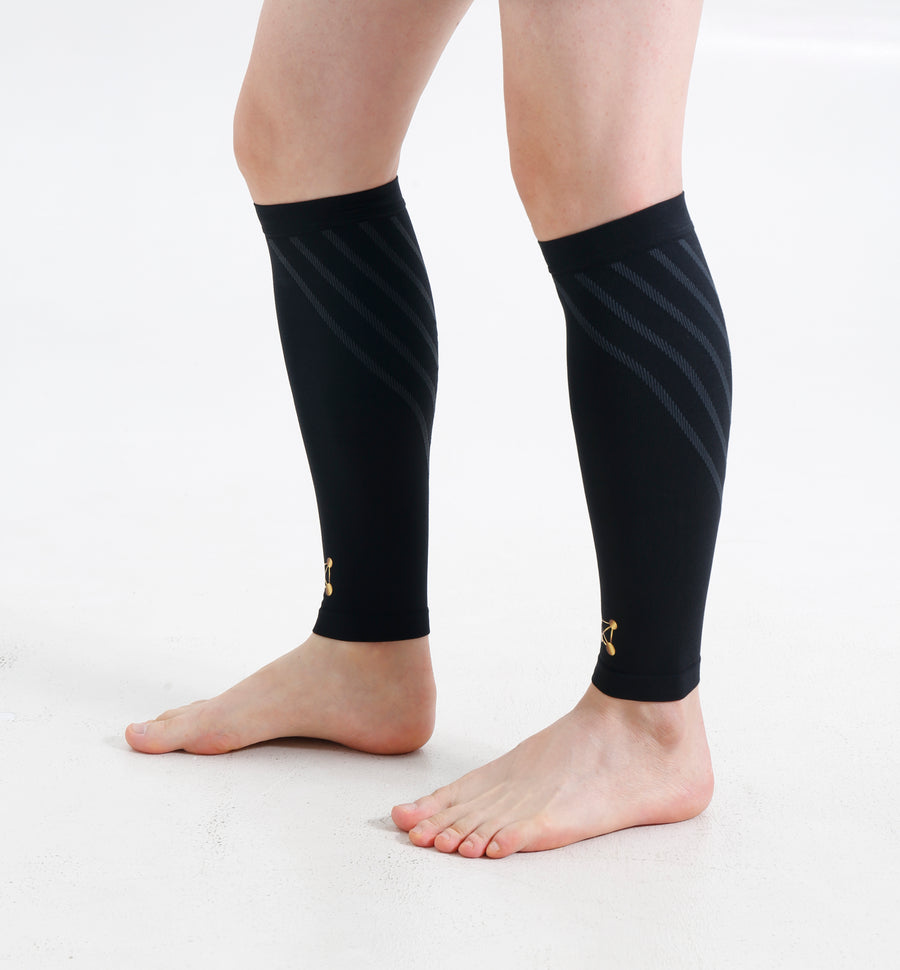 A pair of black CopperJoint copper compression calf sleeves for lower leg and shin support. (side view)